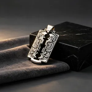Close-up detail of vintage stainless steel military tag pendant with eagle crest