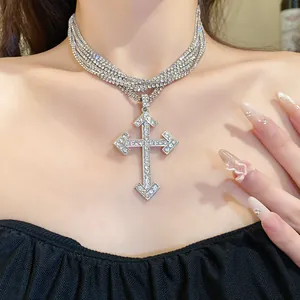 Detailed view of a sparkling multi-layer rhinestone choker featuring a large cross pendant