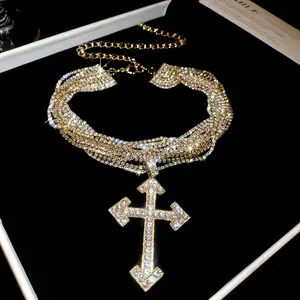 Sparkling rhinestone multi-layered choker necklace with a large cross pendant.