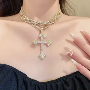 Glittering rhinestone multi-layer choker necklace with a large cross pendant on model