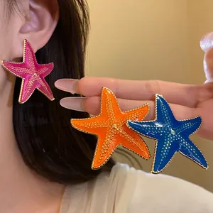 Vibrant summer style enamel starfish stud earrings with elegant gold textured edges