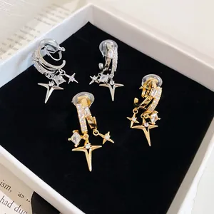 Macro view of 18k gold plated zircon double-layer star ear clips in a jewelry box