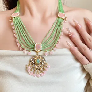 Detailed macro view of the multi-strand vintage resin necklace on an Asian model.