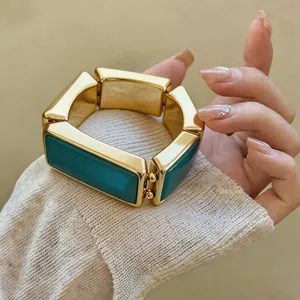 Vintage grove goudkleurige schakelarmband met rechthoekige schakels en diepblauwe emaille