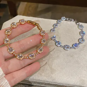Detailed macro shot of sparkling cushion-cut zircon bracelets in gold and silver finish