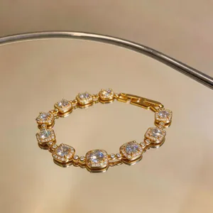Macro view of luxurious 18k gold plated bracelet with sparkling square zircons