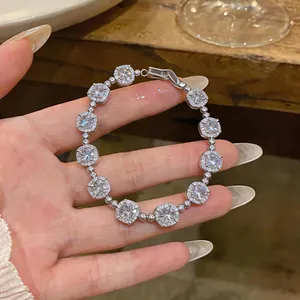 Detailed view of 18k gold plated zircon bracelet featuring square links and shiny stones