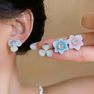 Elegant zircon flower stud earrings in white blue and pink shades for women's daily wear