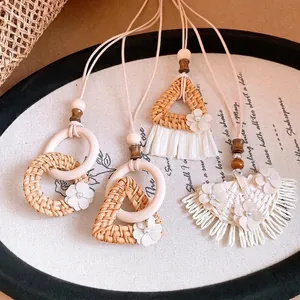 Handmade Bohemian wood and rattan woven necklaces with floral accents for summer