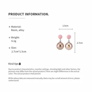 Detail showing measurements and material of polka dot resin drop earrings.