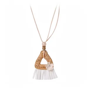 Hand-woven bohemian rattan triangle necklace with elegant white tassel and flower detail
