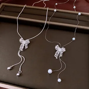 Vintage silver-tone hollow bow adjustable necklace with pearls and snake chain