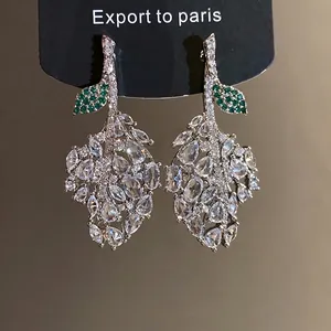 Elegant leaf shaped silver needle earrings with green and white cubic zirconia crystals