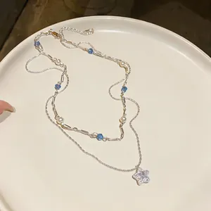 Detailed view of elegant double-layer necklace featuring star zircon pendant and pearls