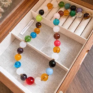 Vibrant multicolored stone beaded necklace for women displayed in a vintage wooden jewelry box