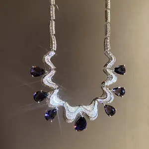Macro view showing the exquisite craft of luxury zircon necklace with navy blue teardrop gems.