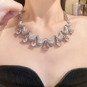 Detailed close-up showing a luxury zircon necklace with elegant pink water drop pendants