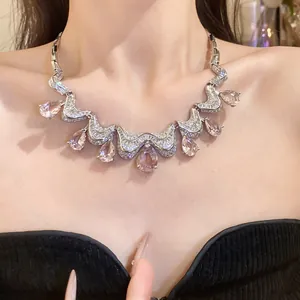 Close-up of elegant luxury teardrop zircon necklace with pink stones on Asian model