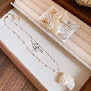 Elegant pearl beaded shell conch pendant necklace and earrings set for summer vacations