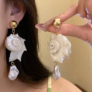 Handmade sea shell and baroque pearl drop earrings designed for beach vacation style