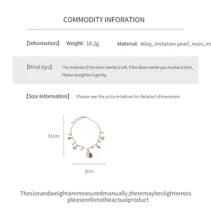 Detailed product specifications for the gold shell and pearl charm necklace with size info