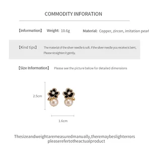 Detailed view of 14k gold plated flower pearl earrings with dimensions and weight info.