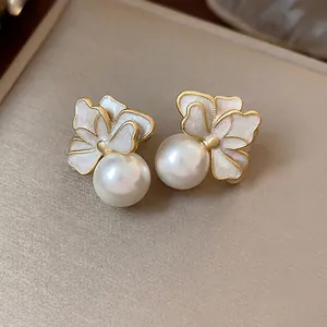 Elegant French style flower pearl stud earrings with white enamel and golden finish