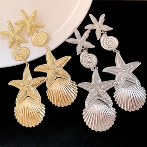 Elegante Seestern und Muschel Ohrhänger in Gold und Silber für einen edlen Look