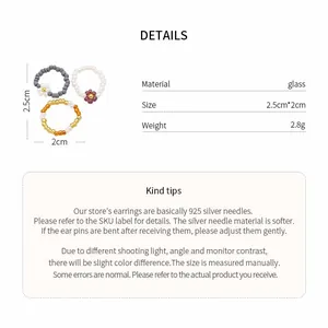 Detailed view of glass beaded flower rings with material, size, and weight specs.