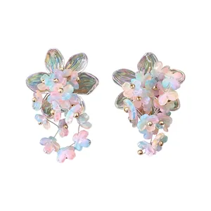 Elegant iridescent acrylic flower stud earrings with colorful dangling floral petals design