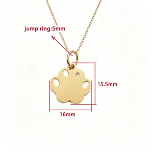 Detailed macro view of gold dog paw pendant necklace showing size dimensions and rhinestone