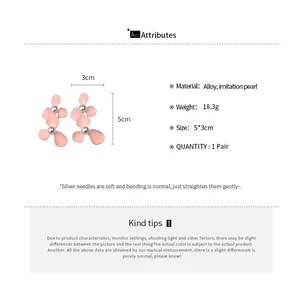 Detailed view of pink petal flower earrings with pearl center and dimension specifications