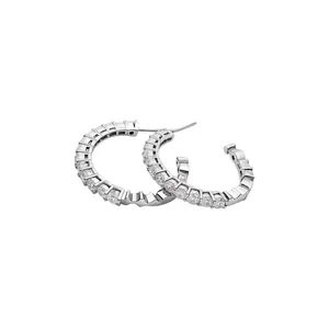 Elegant minimalist silver C-shaped hoop earrings featuring sparkling zirconia stones
