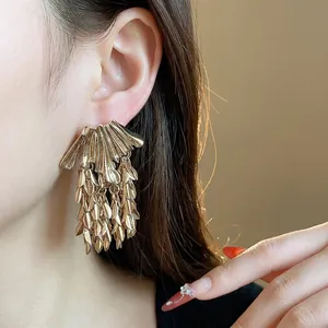 Luxury golden wheat ear leaf tassel stud earrings with an exaggerated design for women