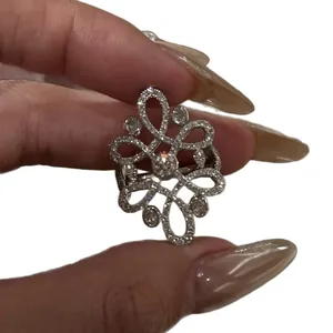 Vintage silver plated floral ring with intricate knot design and full pavé crystals.