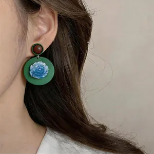 Vintage ethnic style resin flower earrings featuring green discs and blue roses