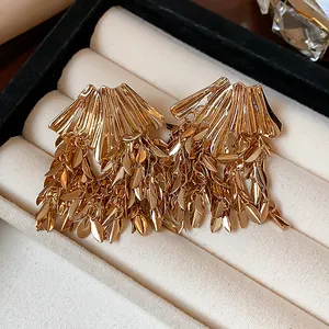 Elegant gold-tone wheat leaf tassel earrings featuring a sophisticated vintage luxury design.