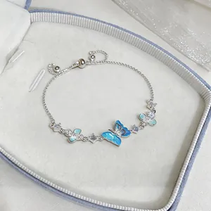 Elegant silver butterfly bracelet with blue gradient wings and sparkling zircon detail.