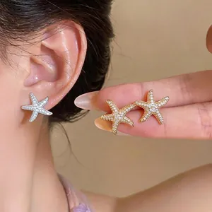 Elegant 18K gold plated starfish stud earrings encrusted with sparkling cubic zirconia