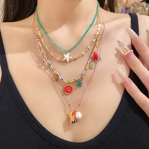 Bohemian layered necklace set with starfish and pearl charms for summer beach vacations