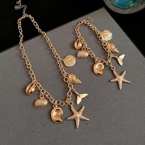 Fashionable gold ocean-themed necklace and bracelet set with starfish and shell charms