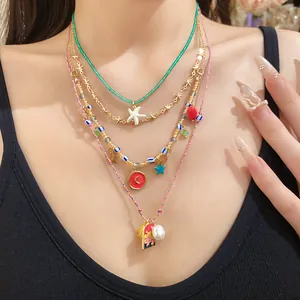 Vintage four-layer necklace set with starfish, moon, and pearl pendants for summer vacation