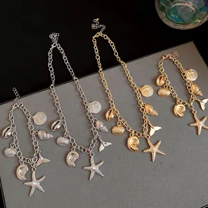 Detailed showcase of gold and silver jewelry sets featuring starfish and shells.