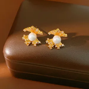 Elegant gold-tone fan-shaped zircon and pearl stud earrings with silver needles for women