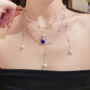 Double-layer pearl necklace with blue water-drop pendant and butterfly accent jewelry