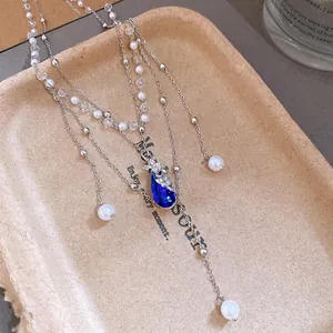 Elegant double-layer necklace with blue water-drop pendant and pearls