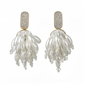 Elegant silver post earrings featuring crystal studs and long white pearl tassel fringe