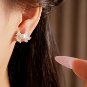 Exquisite close-up detail showing the zircon lace and pearl of the stud earring