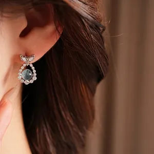 Elegant silver needle zircon stud earrings with blue bead and fishtail design