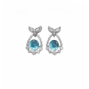 Elegant silver post earrings featuring round blue zircon and fishtail design detail